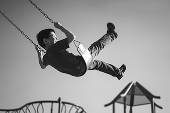 boy swinging