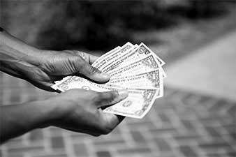 a person fanning money